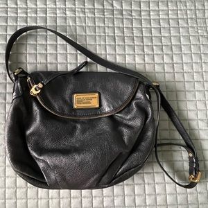 Marc Jacob’s crossbody bag. Black leather. Edgy look, lots of room/pockets.